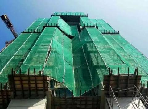 Interesting Facts Why Under Construction Building Is Covered With Green Curtain 1